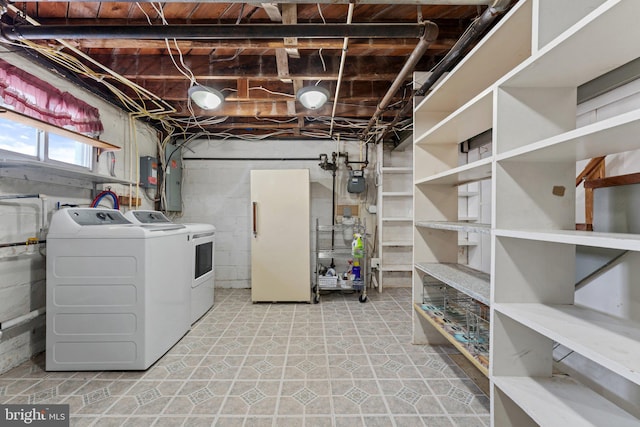 washroom with washing machine and clothes dryer