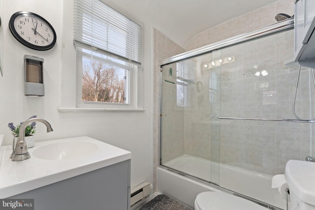 full bathroom featuring vanity, toilet, bath / shower combo with glass door, and baseboard heating