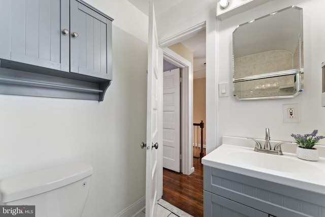 bathroom with tile patterned floors, vanity, and toilet