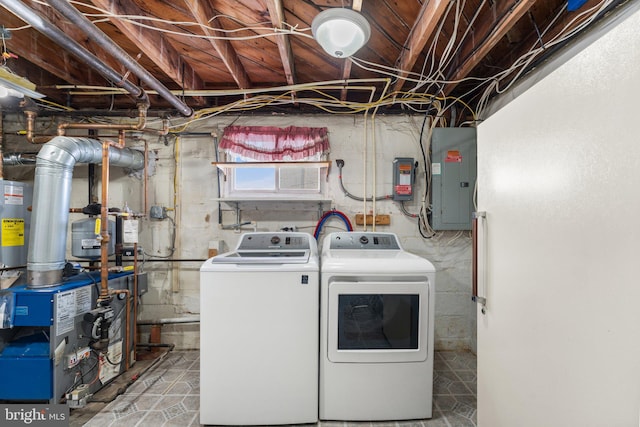 clothes washing area with electric panel and washing machine and clothes dryer