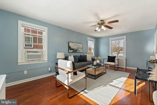 living room with hardwood / wood-style floors, cooling unit, and ceiling fan