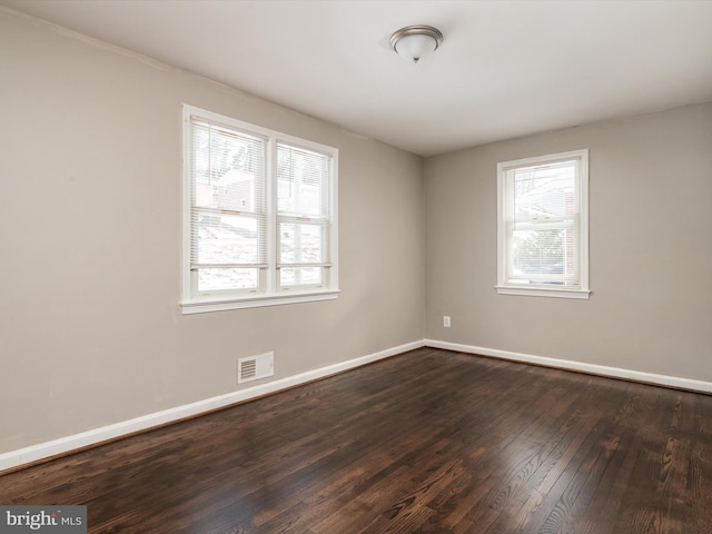 empty room featuring dark hardwood / wood-style floors