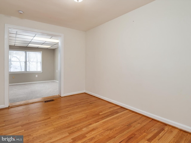 empty room with light hardwood / wood-style floors