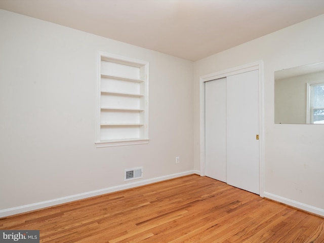 unfurnished bedroom featuring light hardwood / wood-style floors