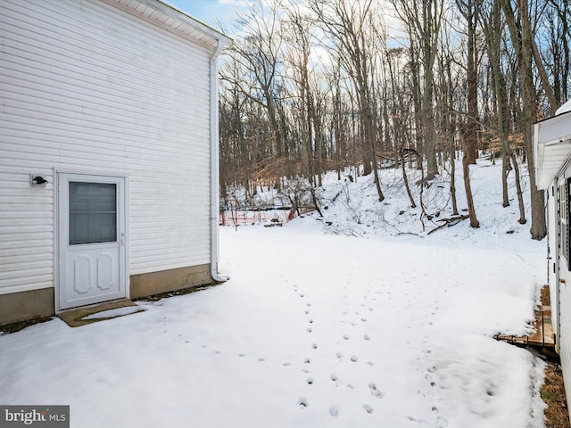 view of yard covered in snow