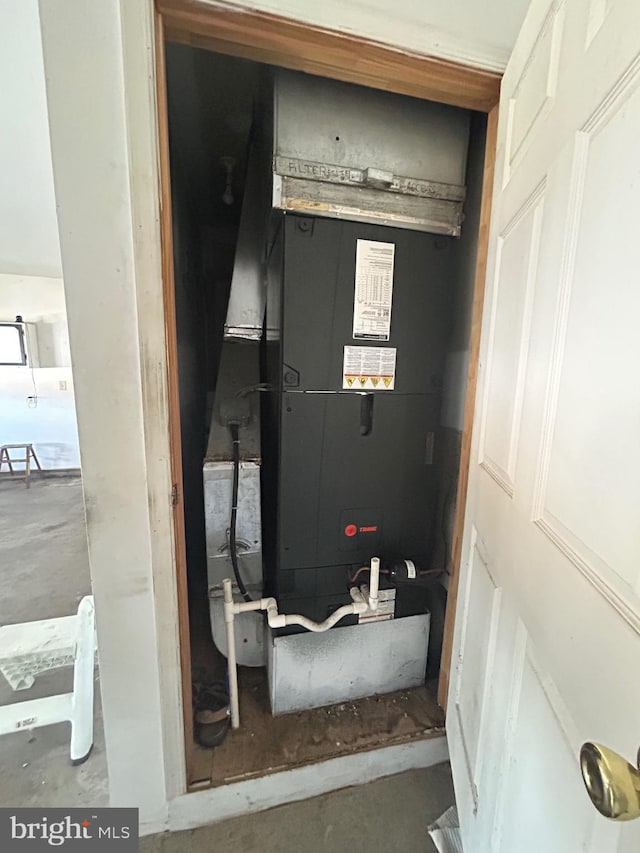 utility room with heating unit