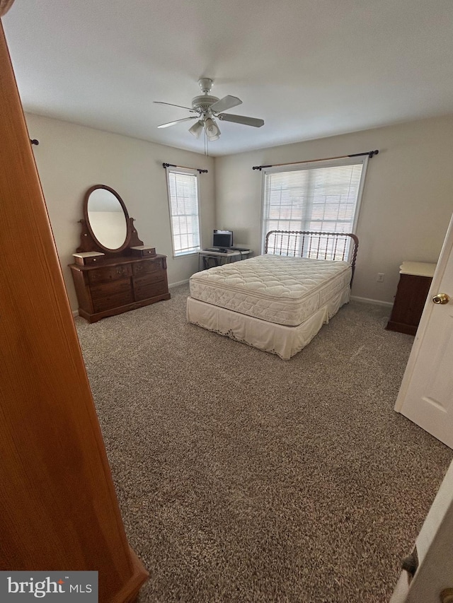 bedroom with ceiling fan and carpet