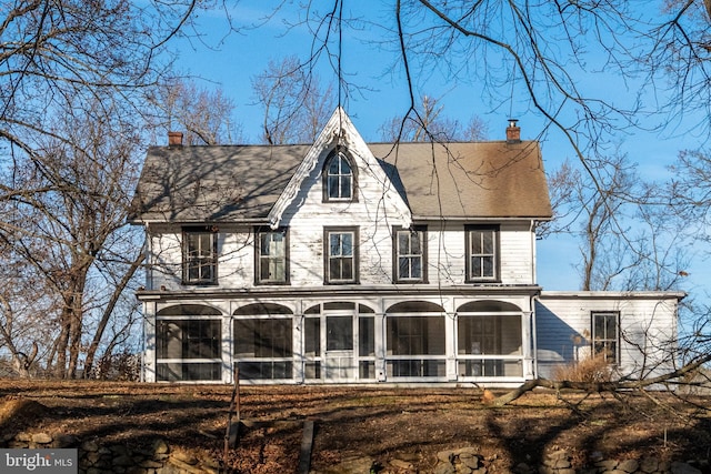 exterior space featuring a sunroom