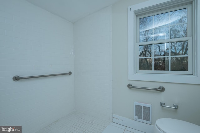 bathroom featuring tile patterned floors and toilet