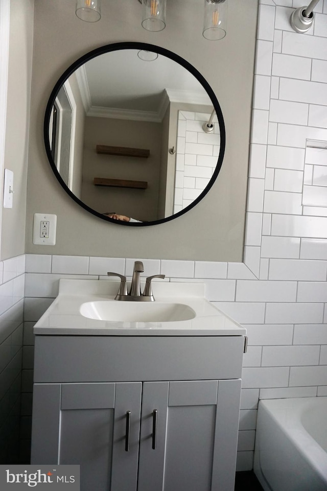 bathroom with vanity, tile walls, and ornamental molding