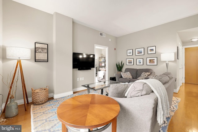 living room with light hardwood / wood-style floors