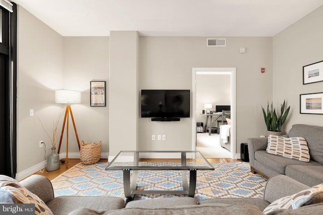 living room with light hardwood / wood-style floors