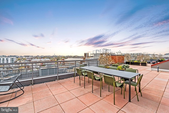 patio terrace at dusk with a balcony