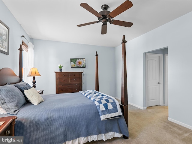 bedroom featuring light carpet and ceiling fan