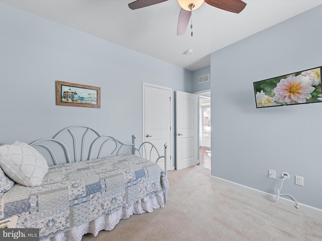 bedroom with light colored carpet and ceiling fan