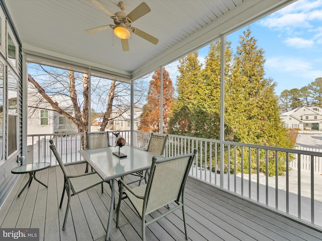 wooden terrace featuring ceiling fan