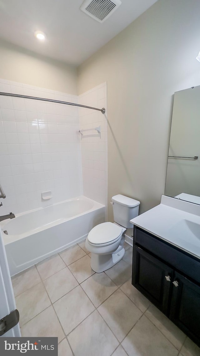 full bathroom with toilet, tiled shower / bath combo, tile patterned flooring, and vanity