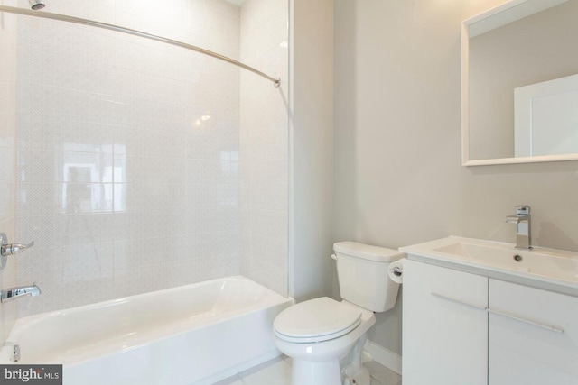 full bathroom with tiled shower / bath combo, toilet, and vanity