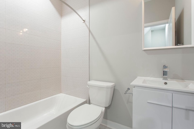 full bathroom with tiled shower / bath combo, toilet, and vanity