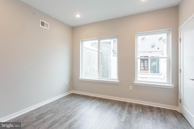 empty room featuring hardwood / wood-style flooring