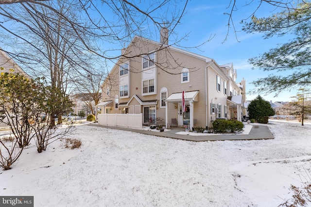 view of snow covered house