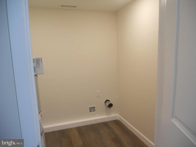 laundry room with dark wood-type flooring