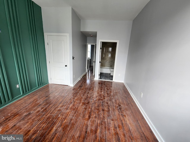 spare room with dark hardwood / wood-style flooring