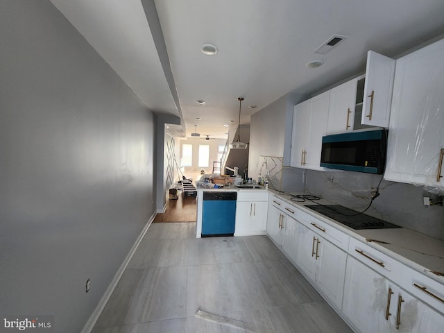 kitchen featuring kitchen peninsula, electric stovetop, decorative light fixtures, dishwasher, and white cabinetry