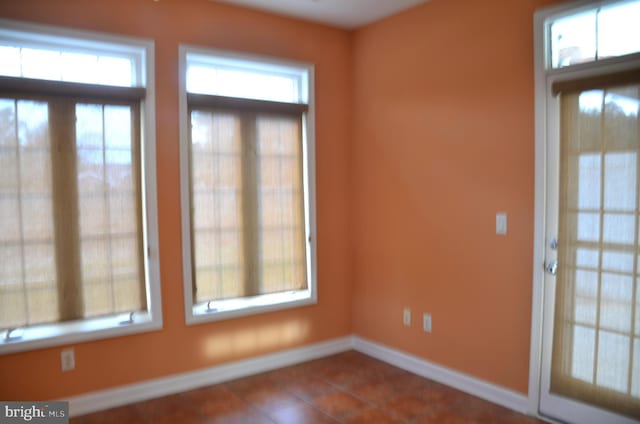 spare room with tile patterned flooring