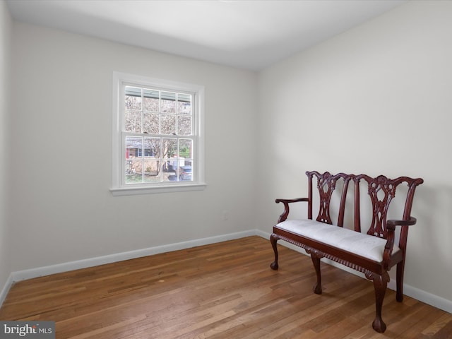 sitting room with light wood-style flooring and baseboards