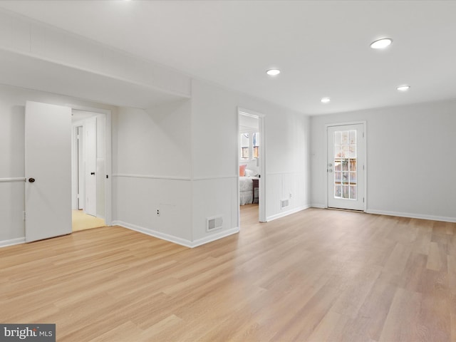 spare room featuring visible vents, recessed lighting, and light wood-style floors