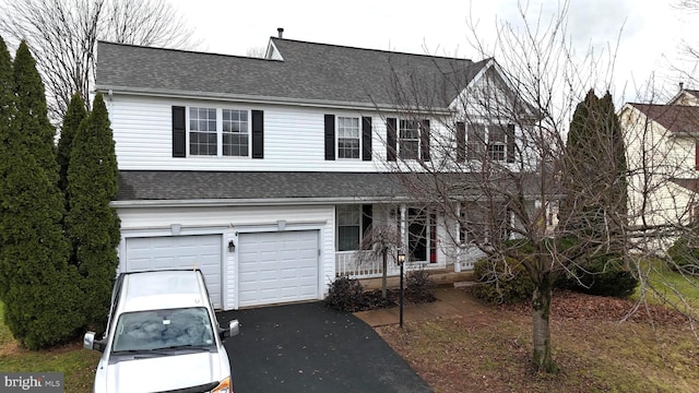 view of front of property with a garage