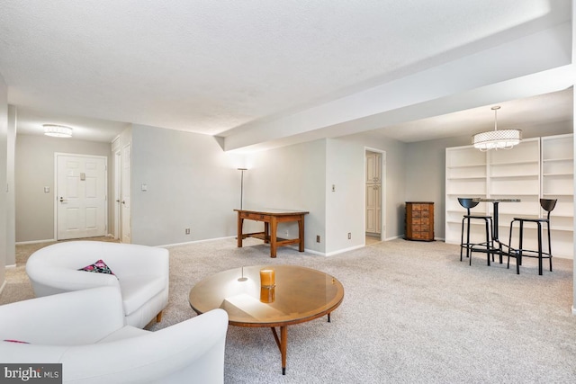 living room with light carpet and an inviting chandelier