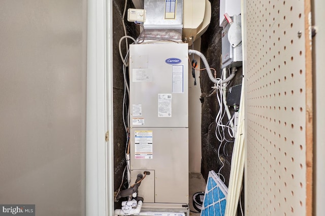 utility room with heating unit