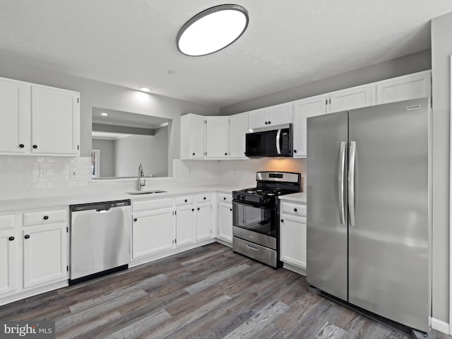 kitchen with white cabinets, stainless steel appliances, and sink