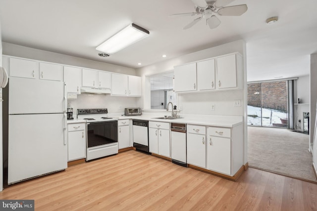 kitchen with ceiling fan, sink, white appliances, white cabinets, and light wood-type flooring