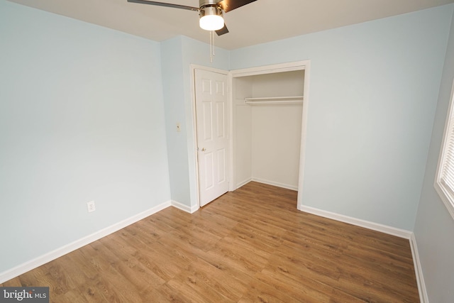 unfurnished bedroom featuring a closet, ceiling fan, and light hardwood / wood-style flooring