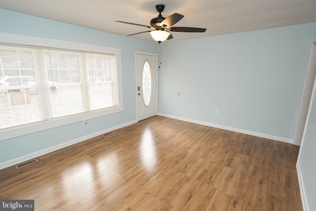 entryway featuring ceiling fan and wood-type flooring