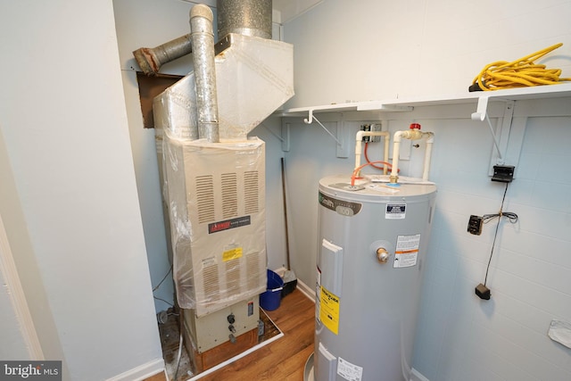 utility room featuring heating unit and water heater