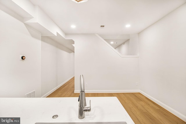 interior space with wood-type flooring and sink