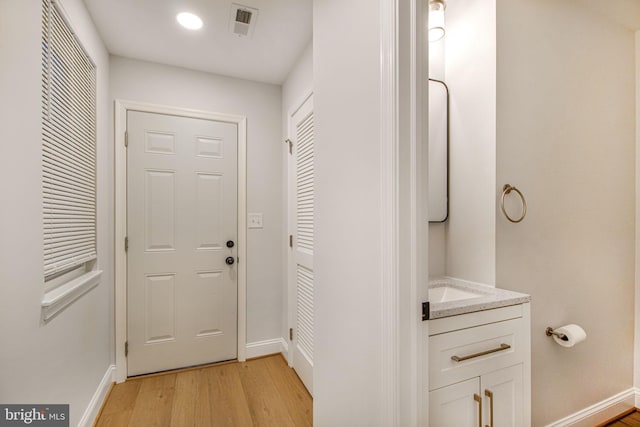 doorway featuring light hardwood / wood-style floors