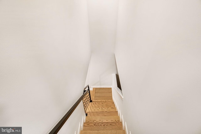 stairway featuring hardwood / wood-style floors