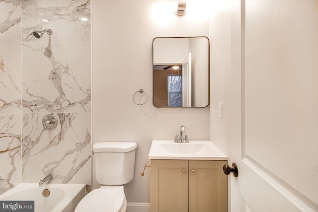 full bathroom featuring vanity, toilet, and tiled shower / bath