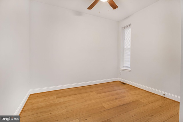 empty room featuring ceiling fan and hardwood / wood-style flooring