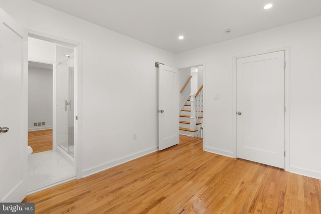 unfurnished bedroom featuring light wood-type flooring