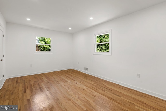 empty room with light hardwood / wood-style floors