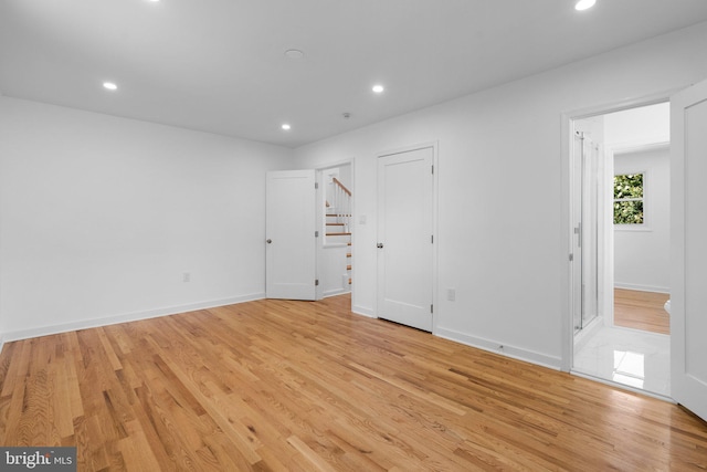 spare room featuring light hardwood / wood-style flooring