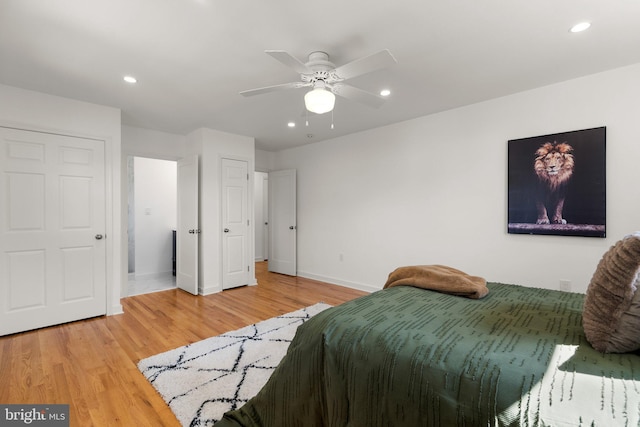 bedroom featuring hardwood / wood-style flooring and ceiling fan