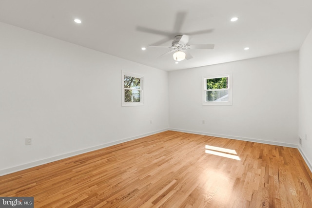 unfurnished room featuring ceiling fan and light wood-type flooring