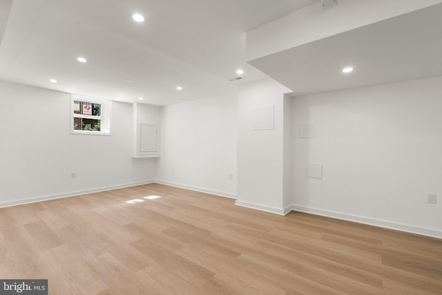 basement featuring light wood-type flooring